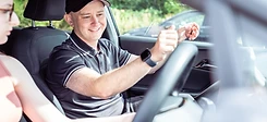 Instructor briefing a learner in the car
