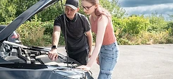 Instructor showing a learner under-bonnet safety checks