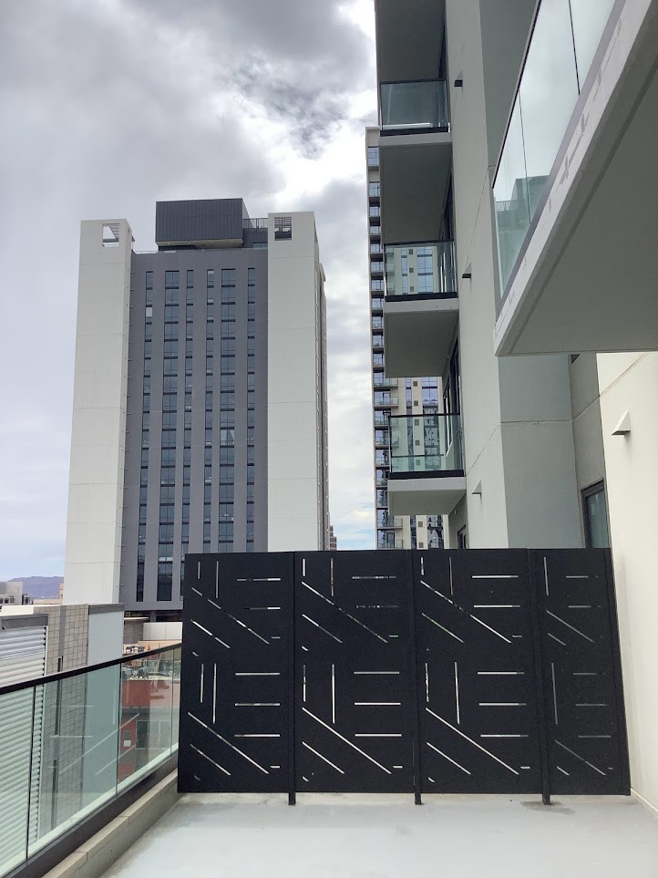 Moon Tower privacy screens installed against an urban backdrop