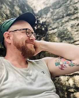 Kyle Piispanen, environmental anthropologist, in natural light during fieldwork