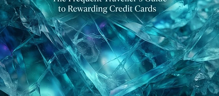 A close up of a metallic travel credit card resting on a passport and boarding pass set against a soft focus airport terminal background.