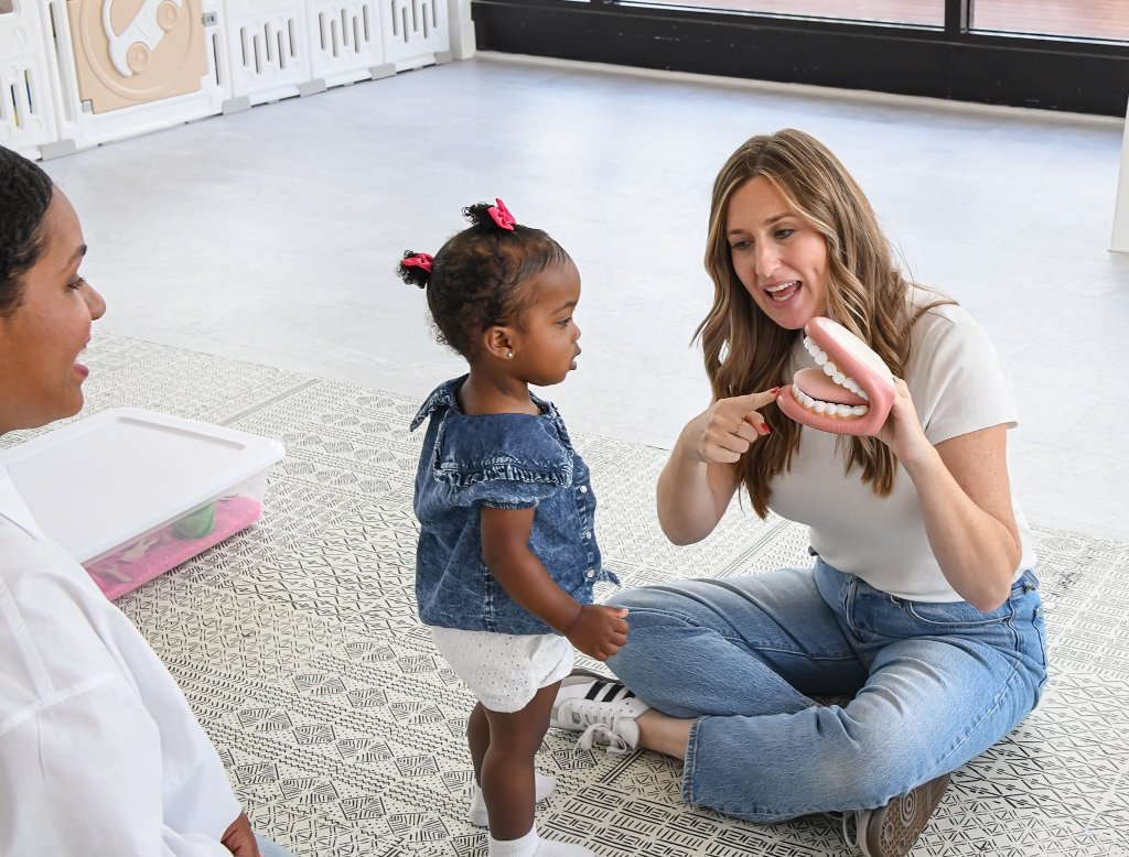 Speech-language pathologist leading a speech therapy session with a child