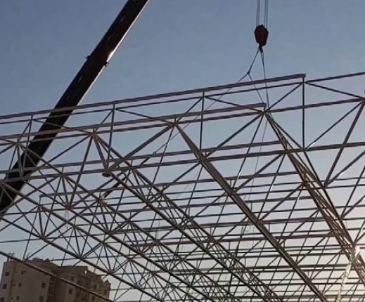 Space frame component being hoisted