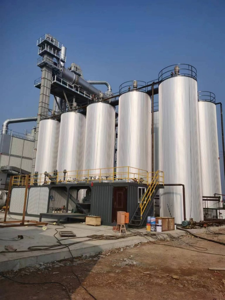 IREGE asphalt mixing plant — storage silos and mixing tower