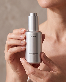 Hands holding the RE:ZEN Brightening Boost Serum