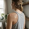 PACHEEZ patch applied to the upper back / shoulder blade