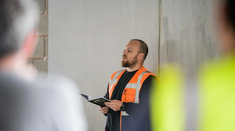 Forge Logistics driver trainer briefing team members during an operational shift