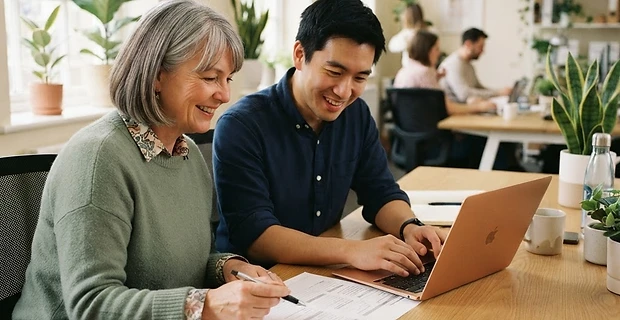People team colleagues reviewing paperwork together in a bright office