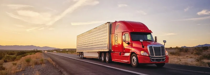 3PL Charlotte distribution center and truck fleet at dawn