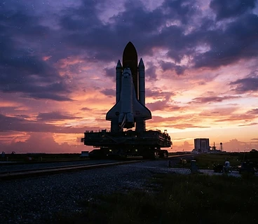 Space shuttle silhouette against a Webster, Texas sunset