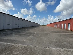 Enclosed boat and RV storage stalls with tall doors at Challenger Storage in Webster, TX