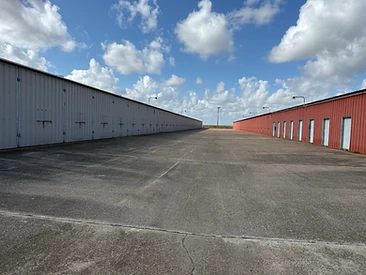 Enclosed boat and RV storage stalls with tall doors at Challenger Storage in Webster, TX
