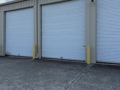 Garage-size drive-up storage units with roll-up doors at Challenger Storage in Webster, TX