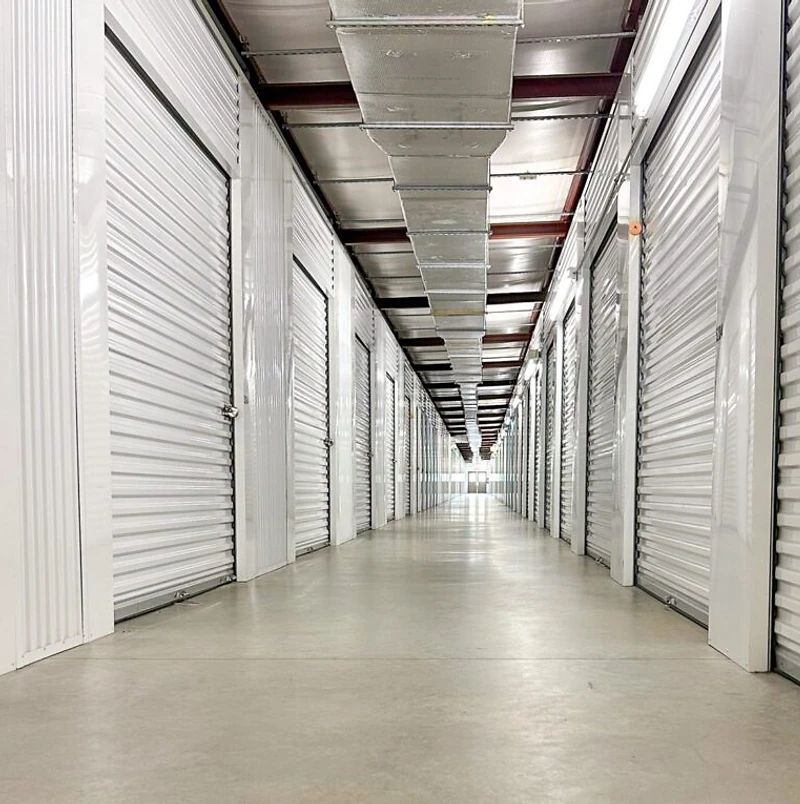 Inside a Challenger Storage facility corridor with rows of storage units
