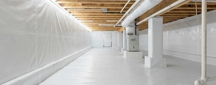 Clean, sealed crawlspace with vapor barrier installation