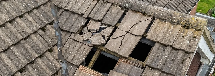 Broken and slipped roof tiles