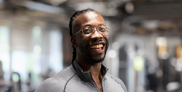 Coach Nate, performance coach, smiling in the gym