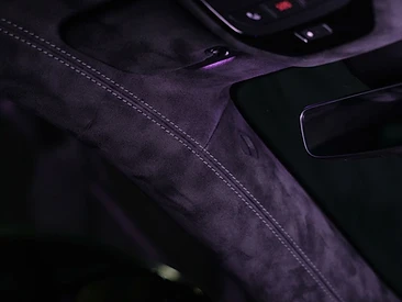 Close-up of black suede headliner with stitched edges