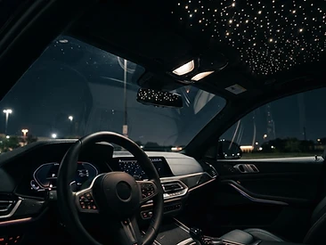 Dense starlight headliner in a dark luxury car interior