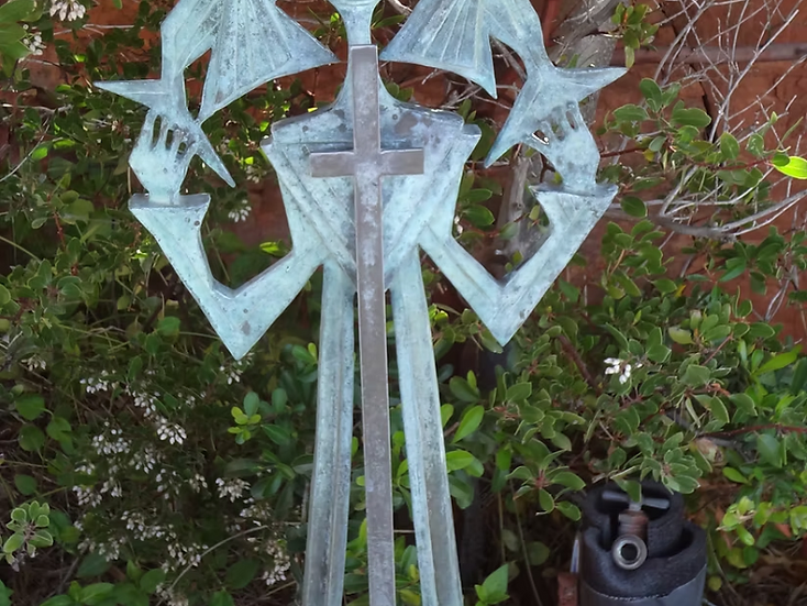 Metal artwork depicting connected figures at Oak Brook Counseling and Wellness