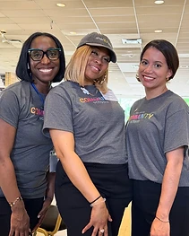 Three sharEDtalent team members in branded shirts