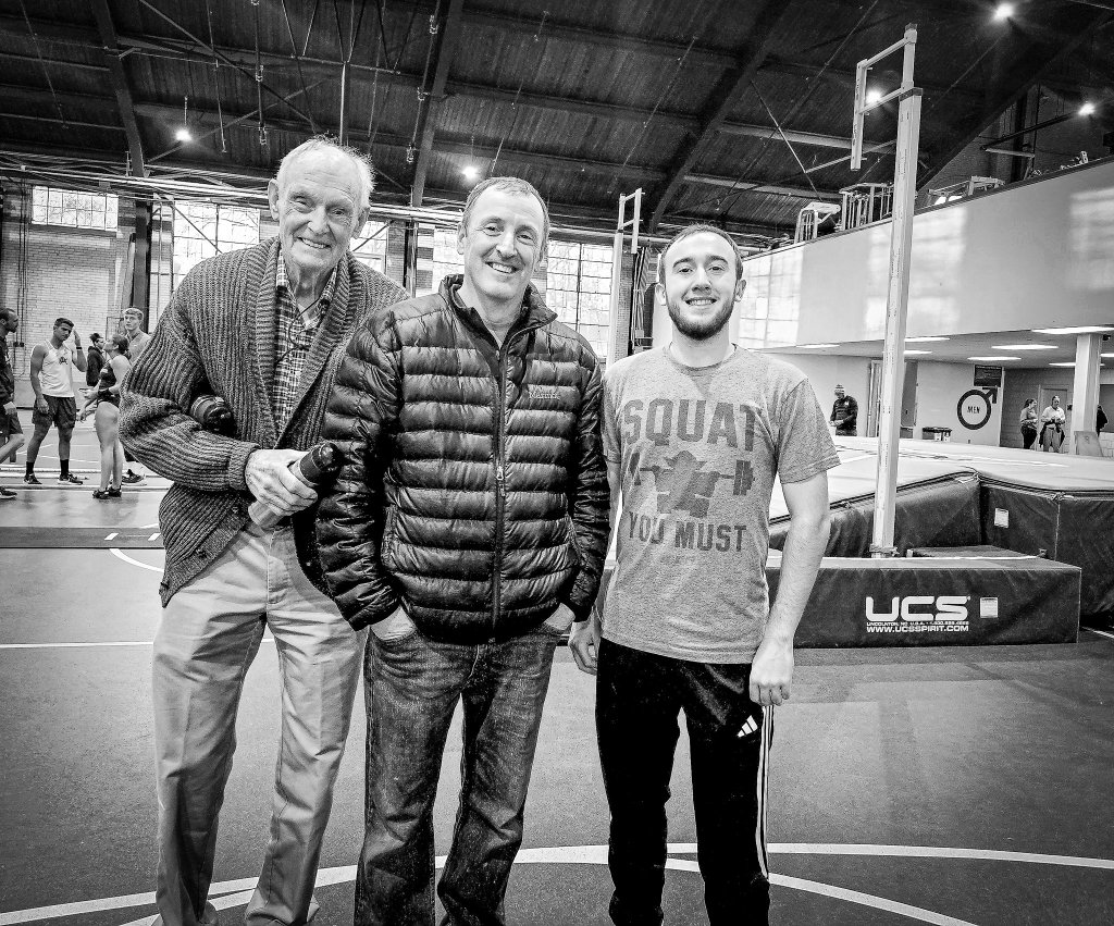 Three generations of pole vaulters together in an indoor training facility