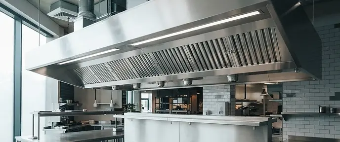 Stainless steel commercial kitchen extraction canopy and baffle filters cleaned to TR19 standard