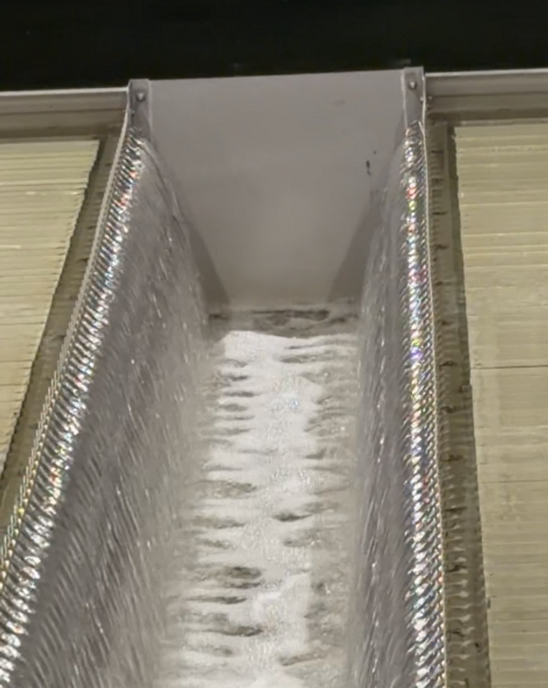 V-notch weir with cascading aerated water in a treatment trough
