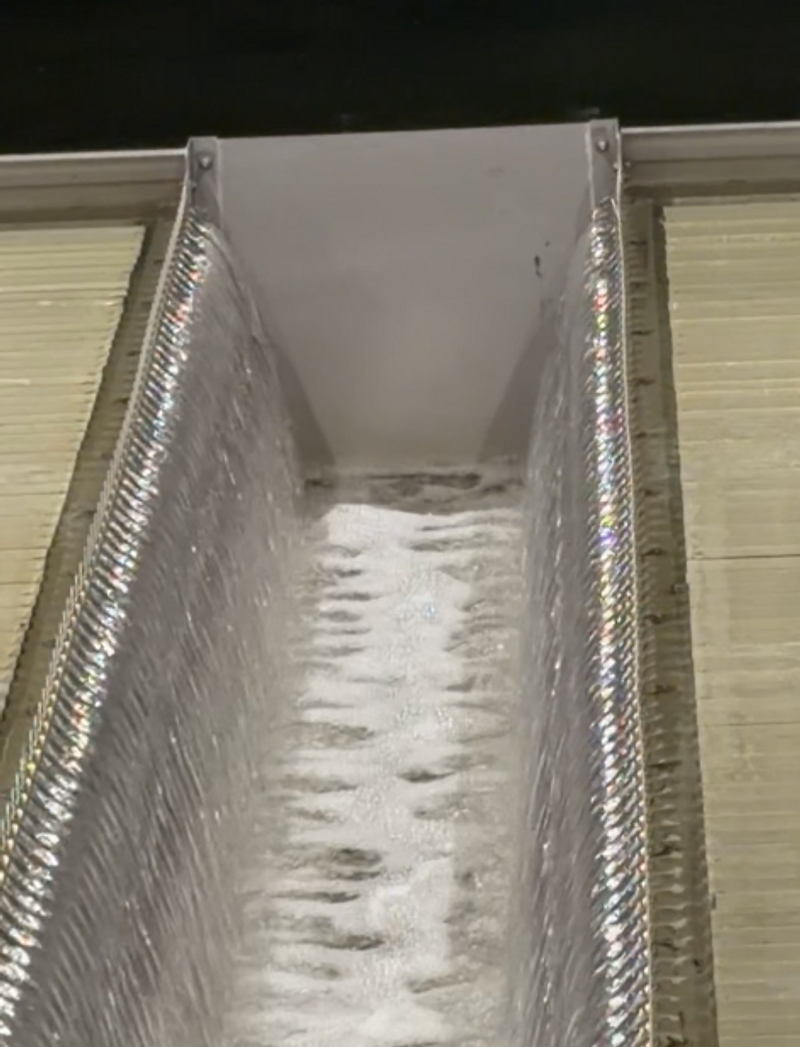 V-notch weir with cascading aerated water in a treatment trough