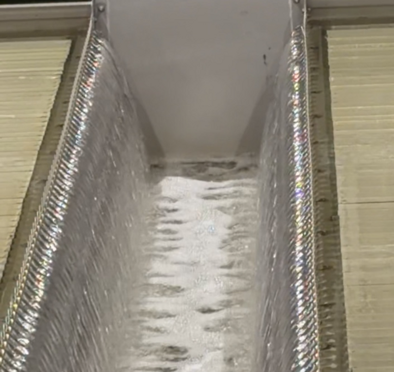V-notch weir with cascading aerated water in a treatment trough
