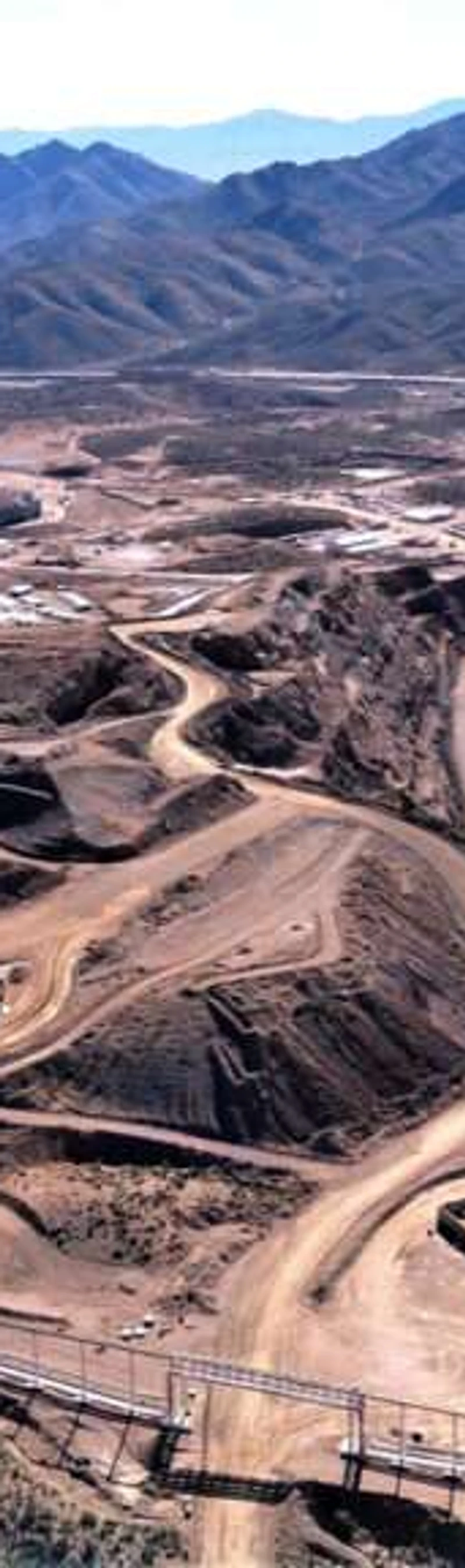 Aerial view of an open-pit rare earth mine — where the lanthanide chemistry begins