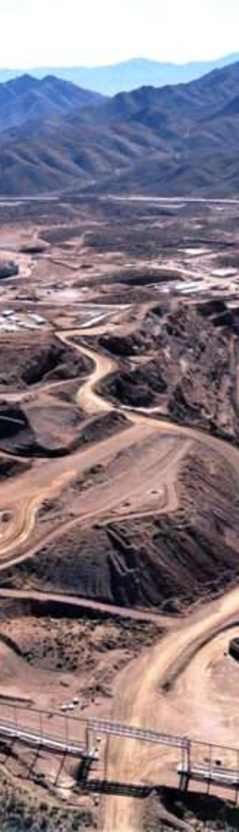 Aerial view of an open-pit rare earth mine — where the lanthanide chemistry begins