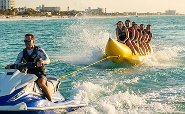 Banana boat ride towed behind a Clearwater jet ski on Clearwater Beach, FL