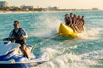 Banana boat ride towed behind a Clearwater jet ski on Clearwater Beach, FL