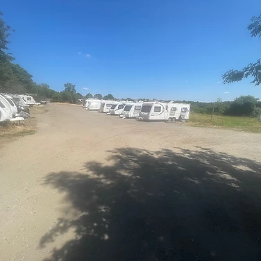 A row of white touring caravans