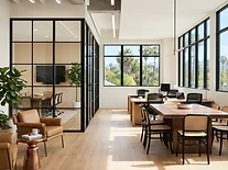 Renovated modern office interior with glass partitions and warm natural light
