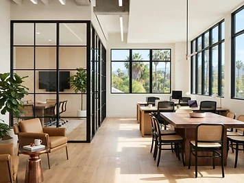 Renovated modern office interior with glass partitions and warm natural light