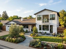Two-story addition on a California ranch home with matching siding and trim