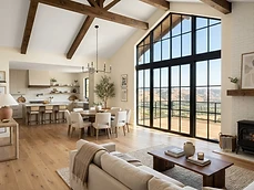 Renovated open-plan living room with vaulted beamed ceiling and large steel-framed windows