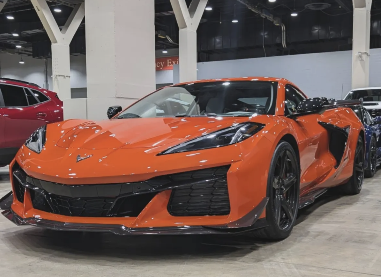 Showroom-quality detailing on a vibrant orange Corvette