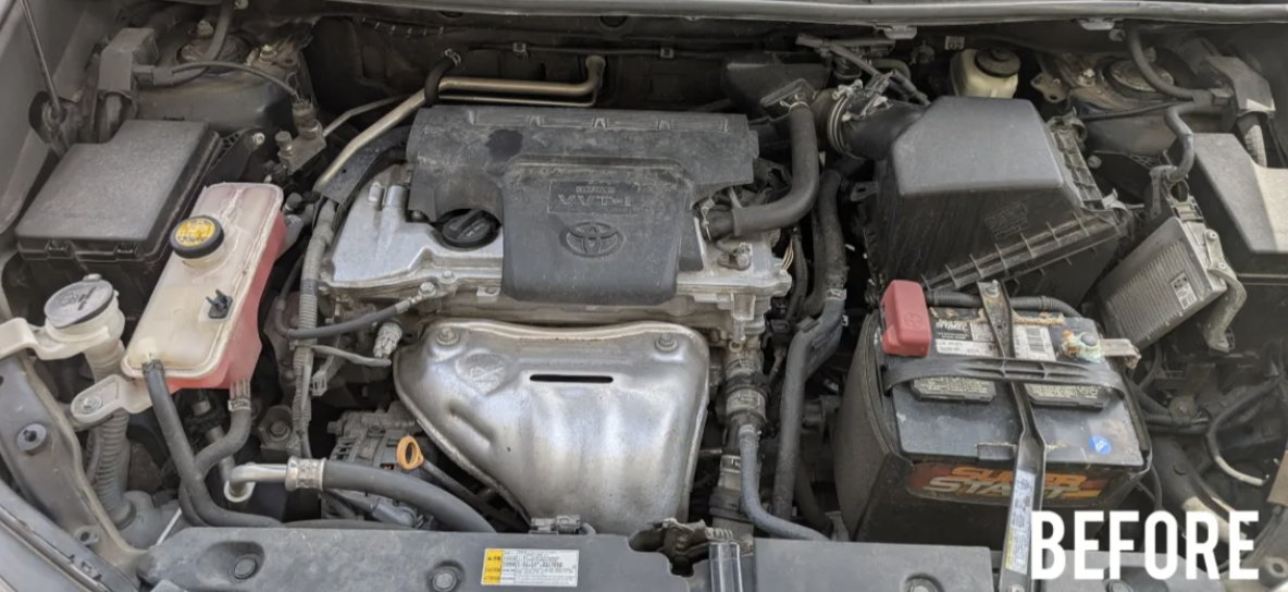 Dirty engine bay — before cleaning