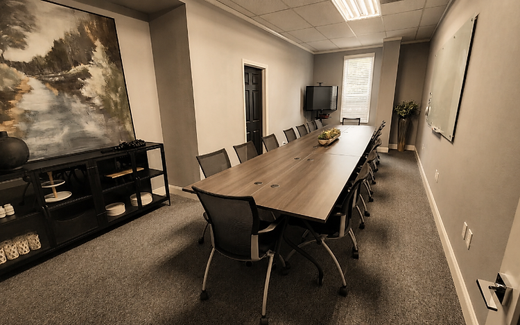 A professional ElmWorks conference room with a conference table and chairs