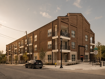 A historic brick building on an Ash Street corner in downtown Frisco