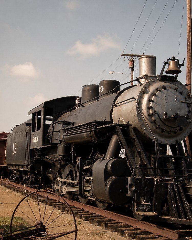 Vintage steam locomotive on the tracks in the Rail District