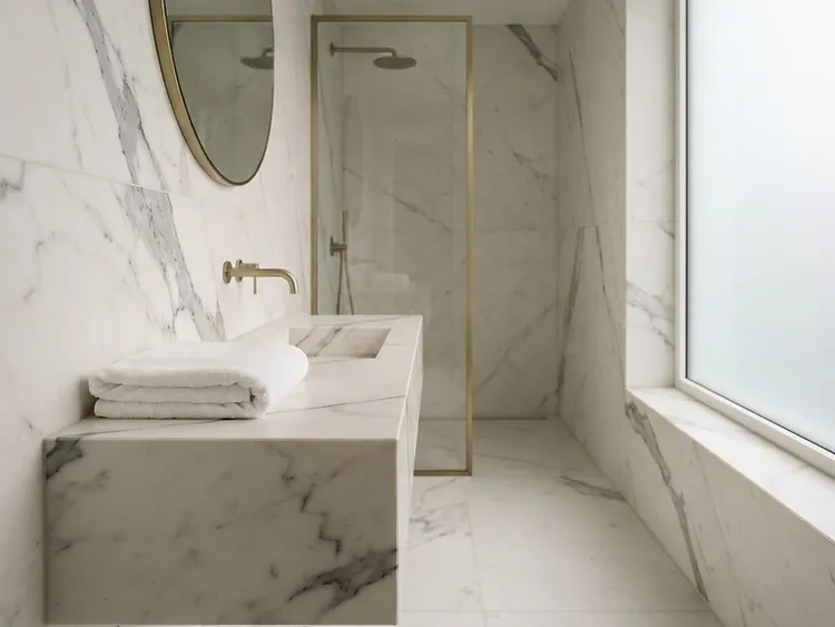 Pristine spa-like marble bathroom after a Wiregrass Cleaning deep house cleaning in Wesley Chapel, FL