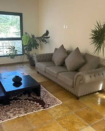 Sala con televisión de Villa Lorena