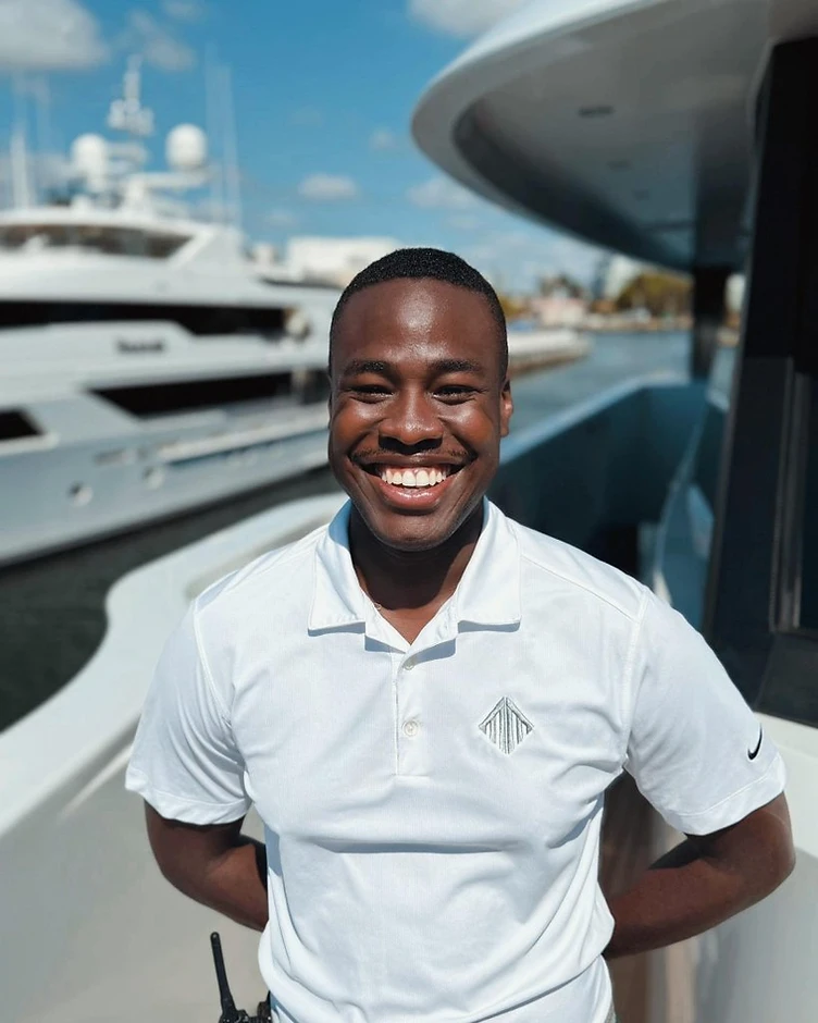 Duvon Green, founder of 876Seafarer, in maritime work attire on a vessel deck