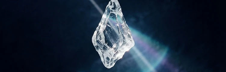 Light refracting through a prism of clear ice