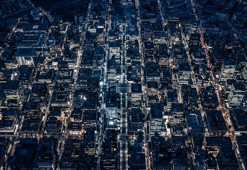 Aerial view of a modern European business district at blue hour