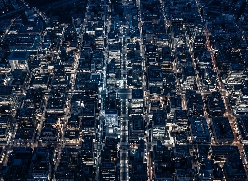 Aerial view of a modern European business district at blue hour